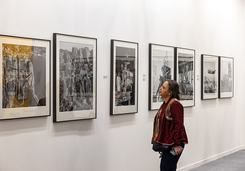 Visitor at PHOTOINK at India Art Fair Delhi 2025 Courtesy of India Art Fair